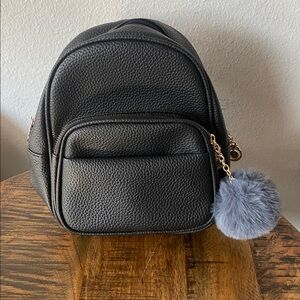 Chic Black Backpack with Fluffy Gray Pom Pom